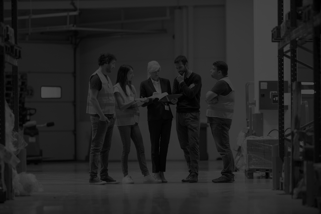 Warehouse staff meeting, workers with managers