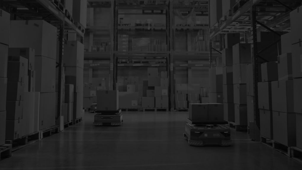 Automated Modern Retail Warehouse AGV Robots Transporting Cardboard Boxes in Distribution Logistics Center.