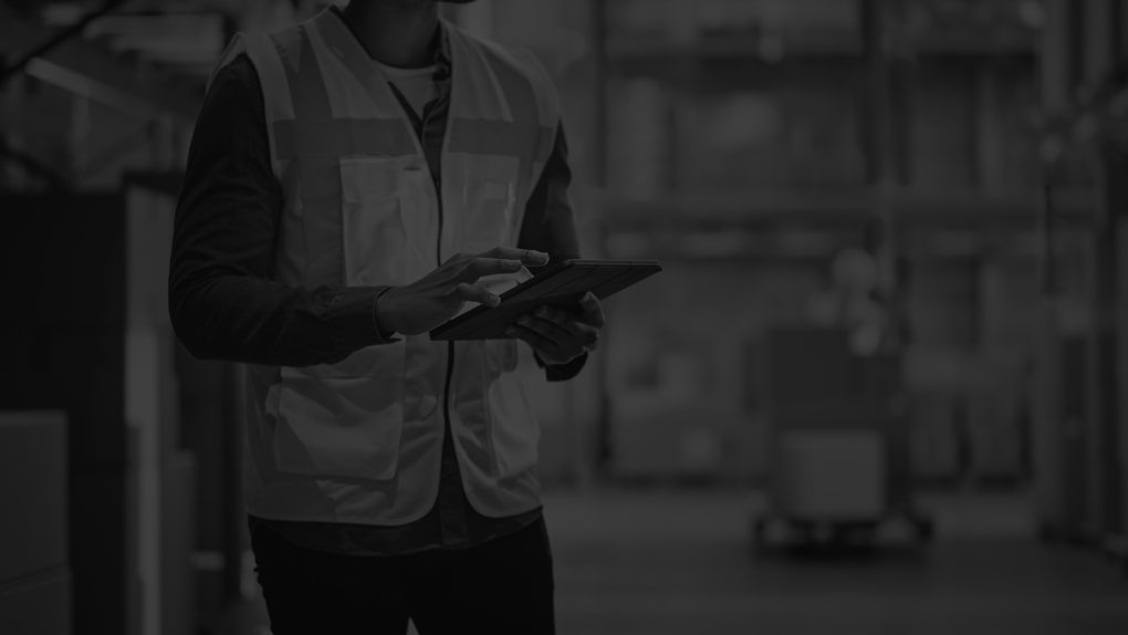 Male Worker Checks Products Stock and Inventory with Digital Tablet Standing in Retail Warehouse