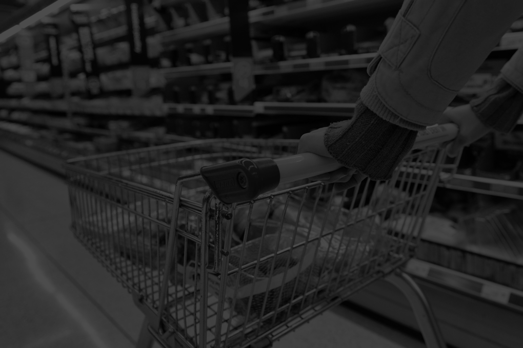 A-shopper-pushes-a-trolley-along-an-aisle-in-an-supermarket.