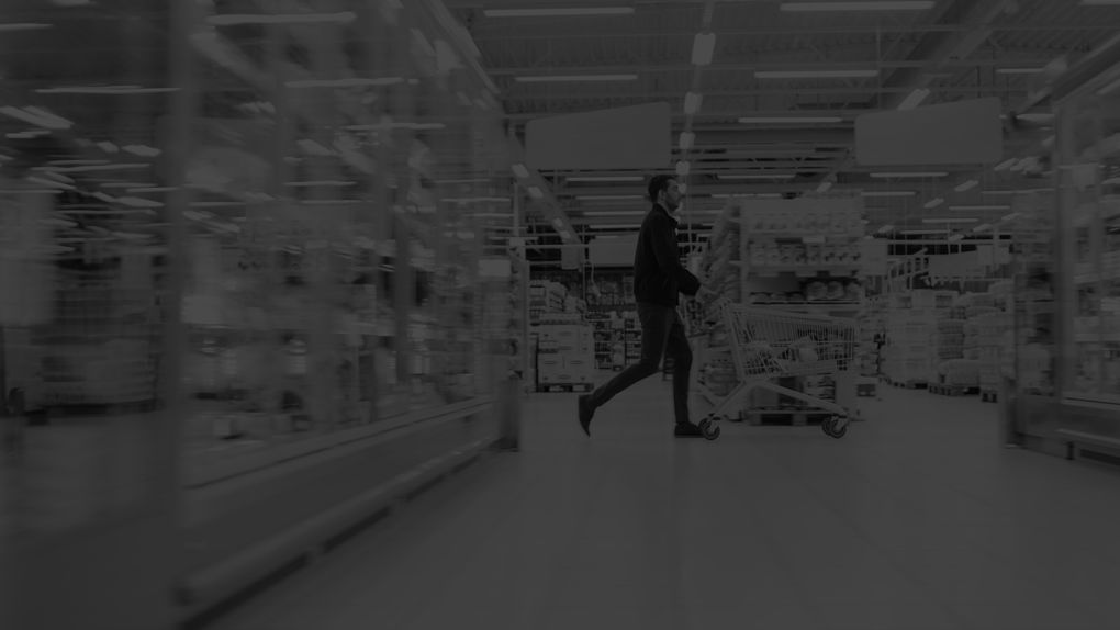 At-the-Supermarket,-Man-in-a-Hurry-Pushes-Shopping-Cart-full-of-Items