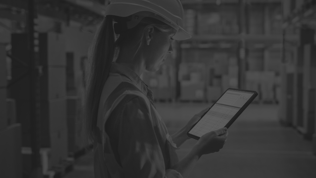 woman in warehouse on tablet
