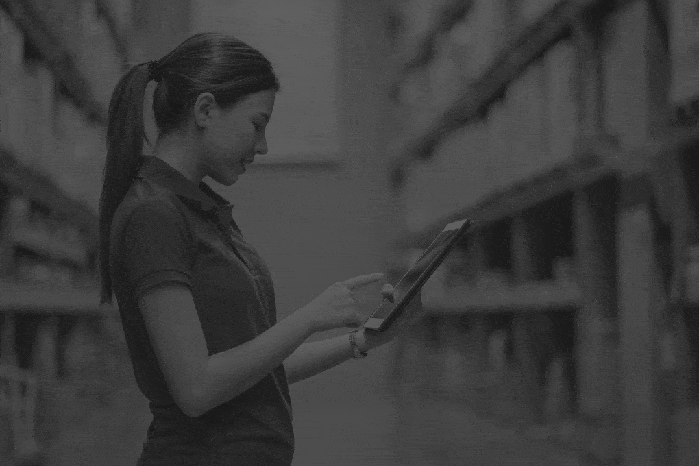 Young-female-worker-in-blue-uniform-checklist-manage-parcel-box-product-in-warehouse.