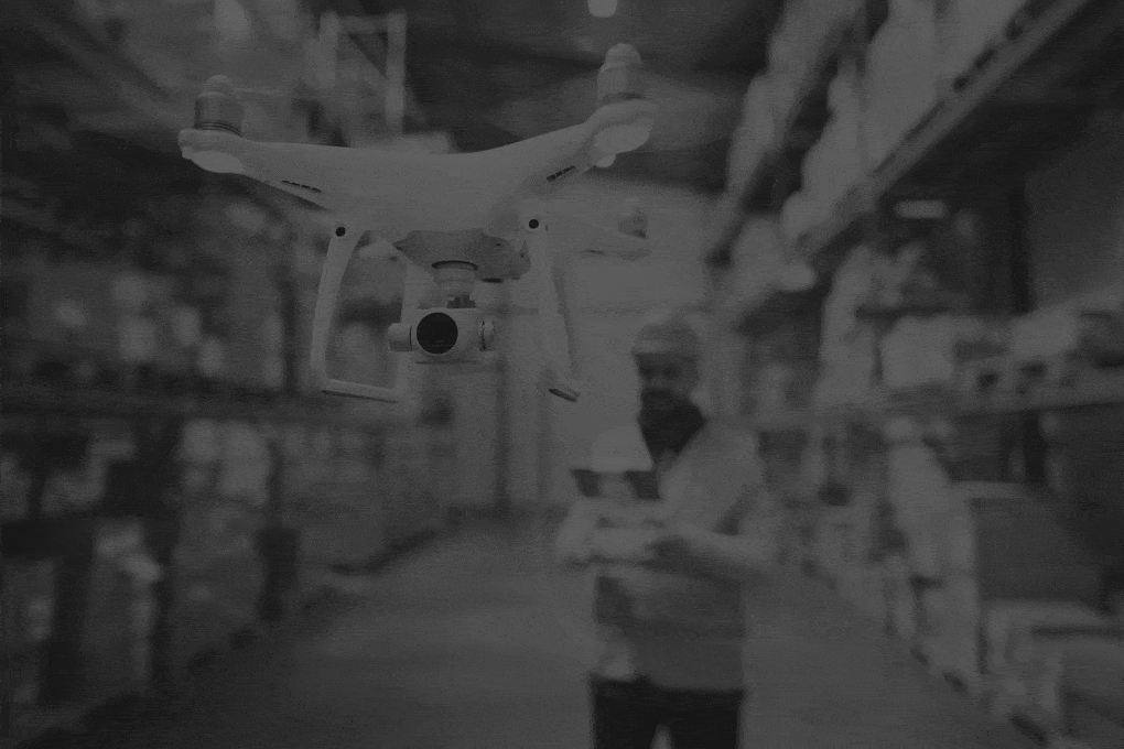 Man-with-drone-in-a-warehouse.