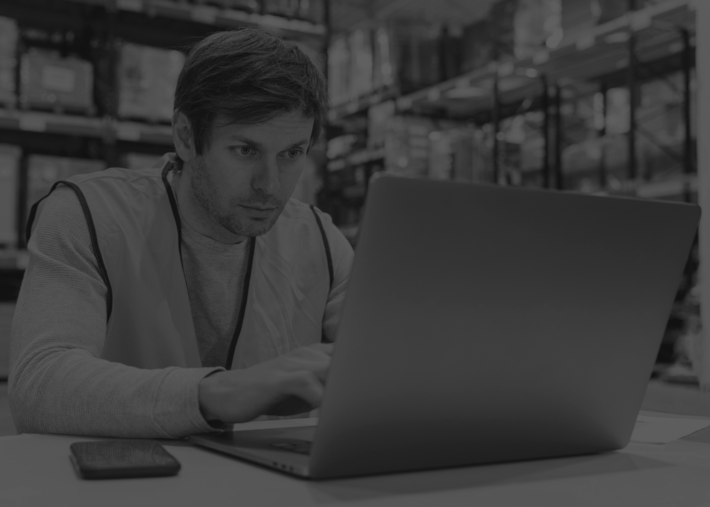 man-warehouse-working-laptop