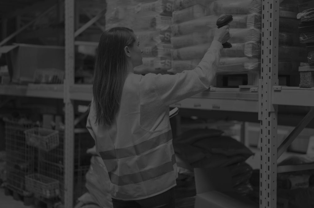 medium shot woman checking package black and white