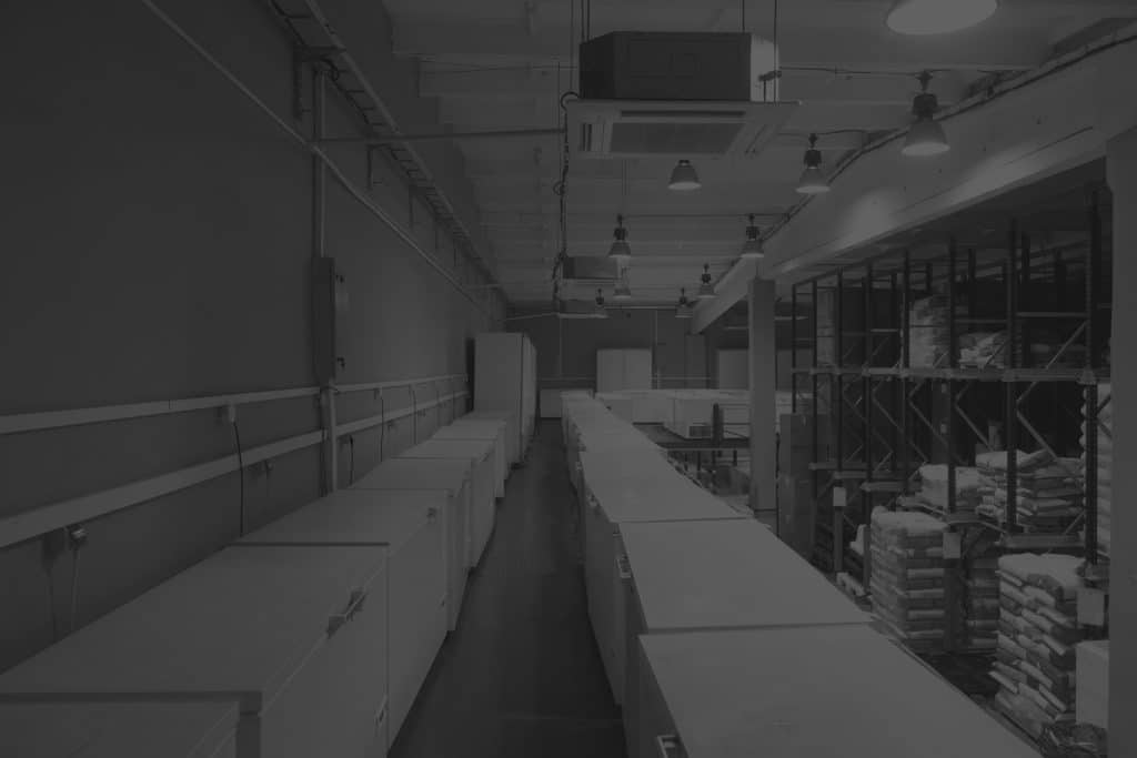 High angle view of freezers in a warehouse storing cold items. Image in black and white.