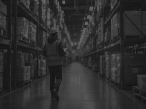 man with checkboard walking through aisle black and white