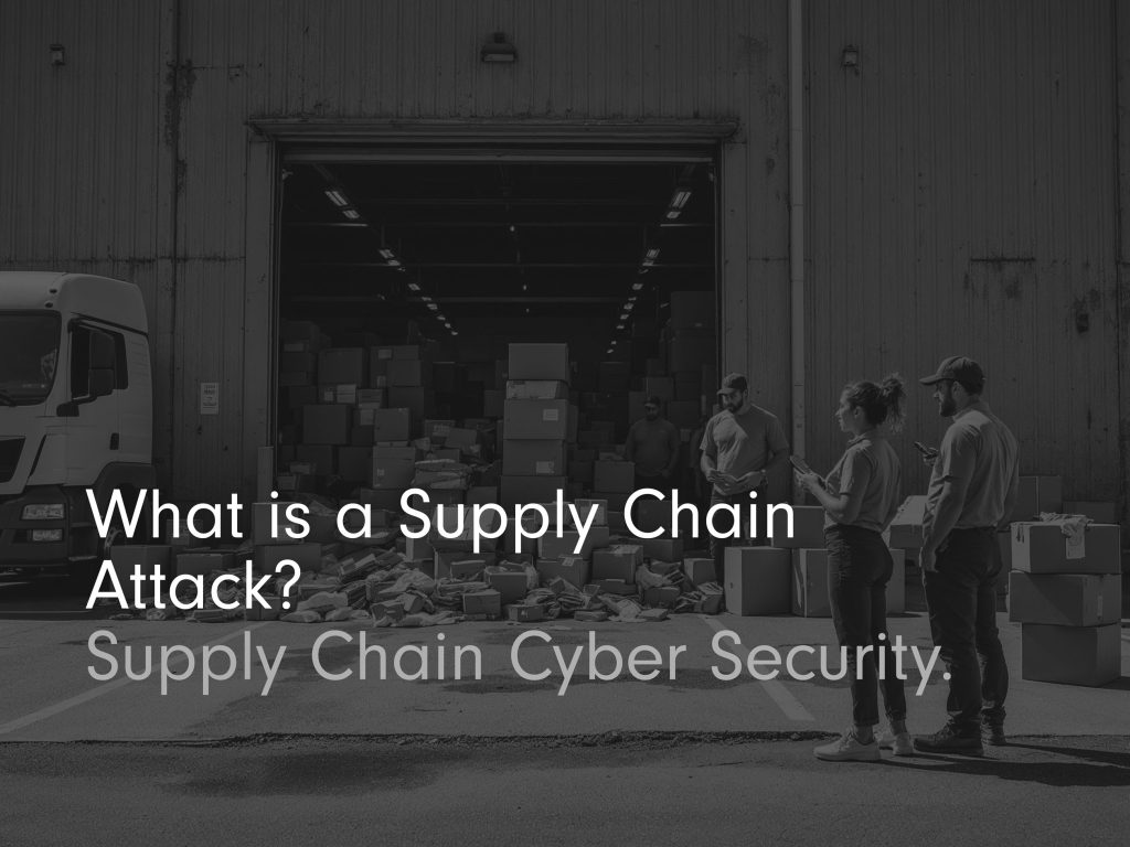 what is a supply chain attack? title image black and white with piled up boxes at entrance of shutter door