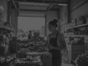 woman in wareous outbound inspecting food black and white